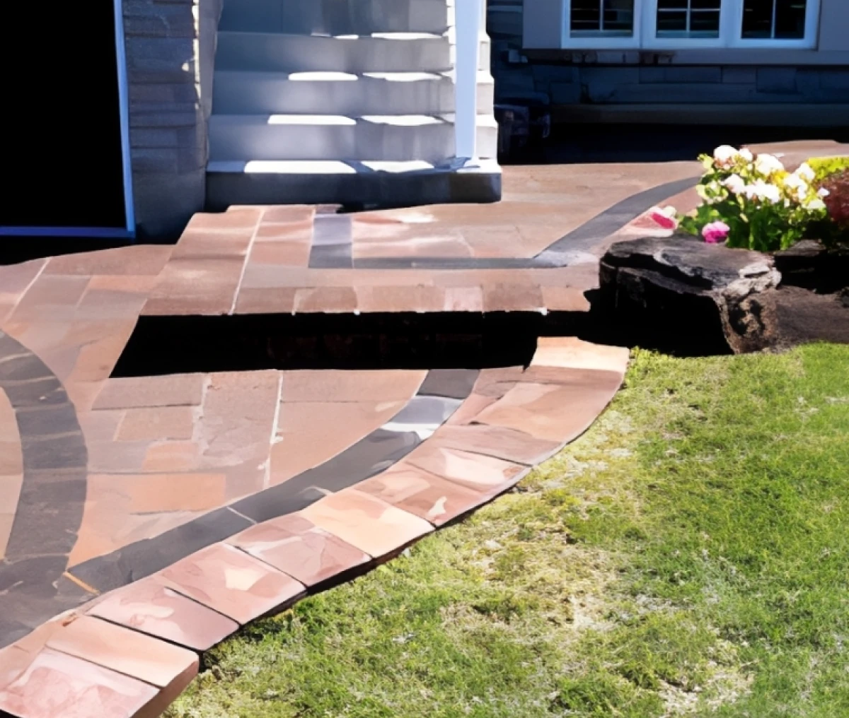 Curved stone walkway with grass border